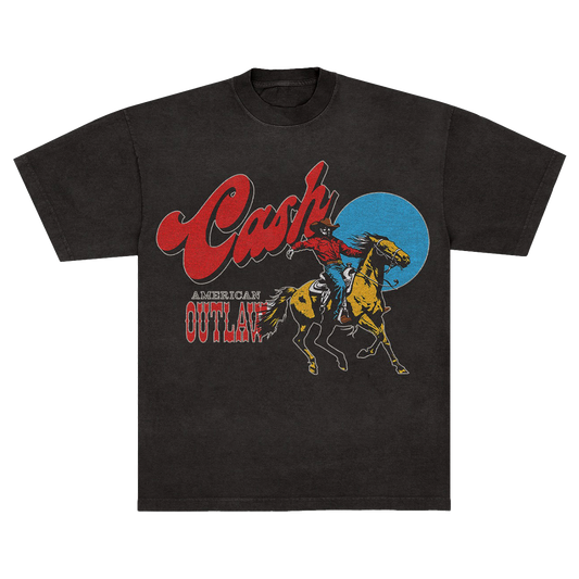 Black unisex t-shirt featuring a cowboy graphic and "Cash" logo above the text "American Outlaw" in a western style font
